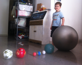 Using a series of balls, each representing a different body in our solar system, I attempt to make P understand the amount of time we don't have to reach our connecting flight.